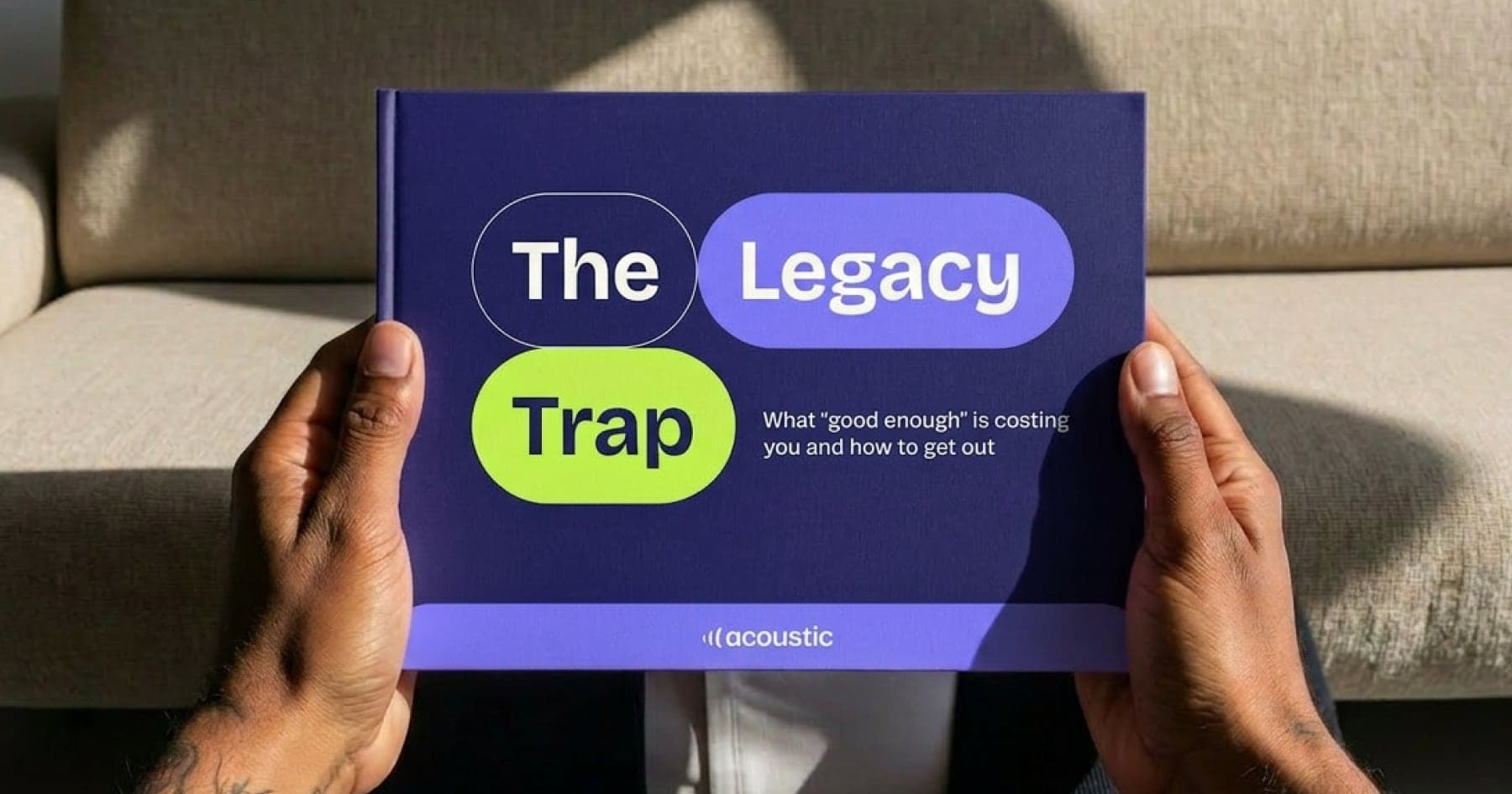 Hands holding 'The Legacy Trap' booklet with violet and lime speech-bubble lettering
