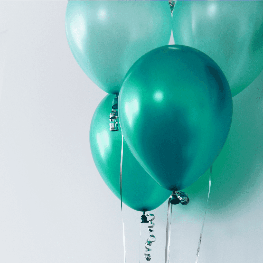 A bundle of teal-colored balloons.