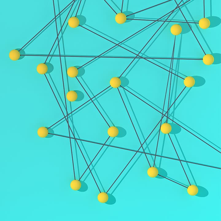 Image shows a geometric structure, with yellow balls connected by dark gray string, over a turquoise background